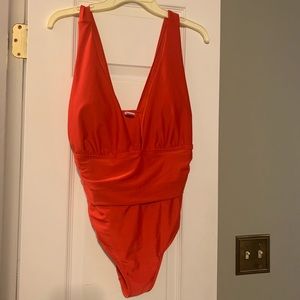 Red one piece swimsuit.